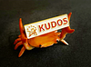 Crab holding sign that says kudos