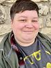 A selfie of me: a fat, androgynous human with short hair and a fade.