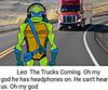 Ninja turtle Leonardo. He's wearing headphones and is clueless to the truck behind him, which is clearly about to hit him. There's text in a white box which reads: "Leo The Trucks Coming. Oh my god he has headphones on. He can't hear us. Oh my god."