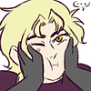 dio looking blandly at the camera, as two gray anon hands squish his cheeks together