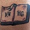 Tattoo of an open book with the letters R and W on the left and H and G on the right, for Ron Weasley and Hermione Granger.