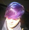 a person with purple hair and closed eyes