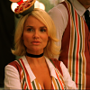 Olive Snook from Pushing Daisies, wearing a tiny pie hat and a striped blouse.